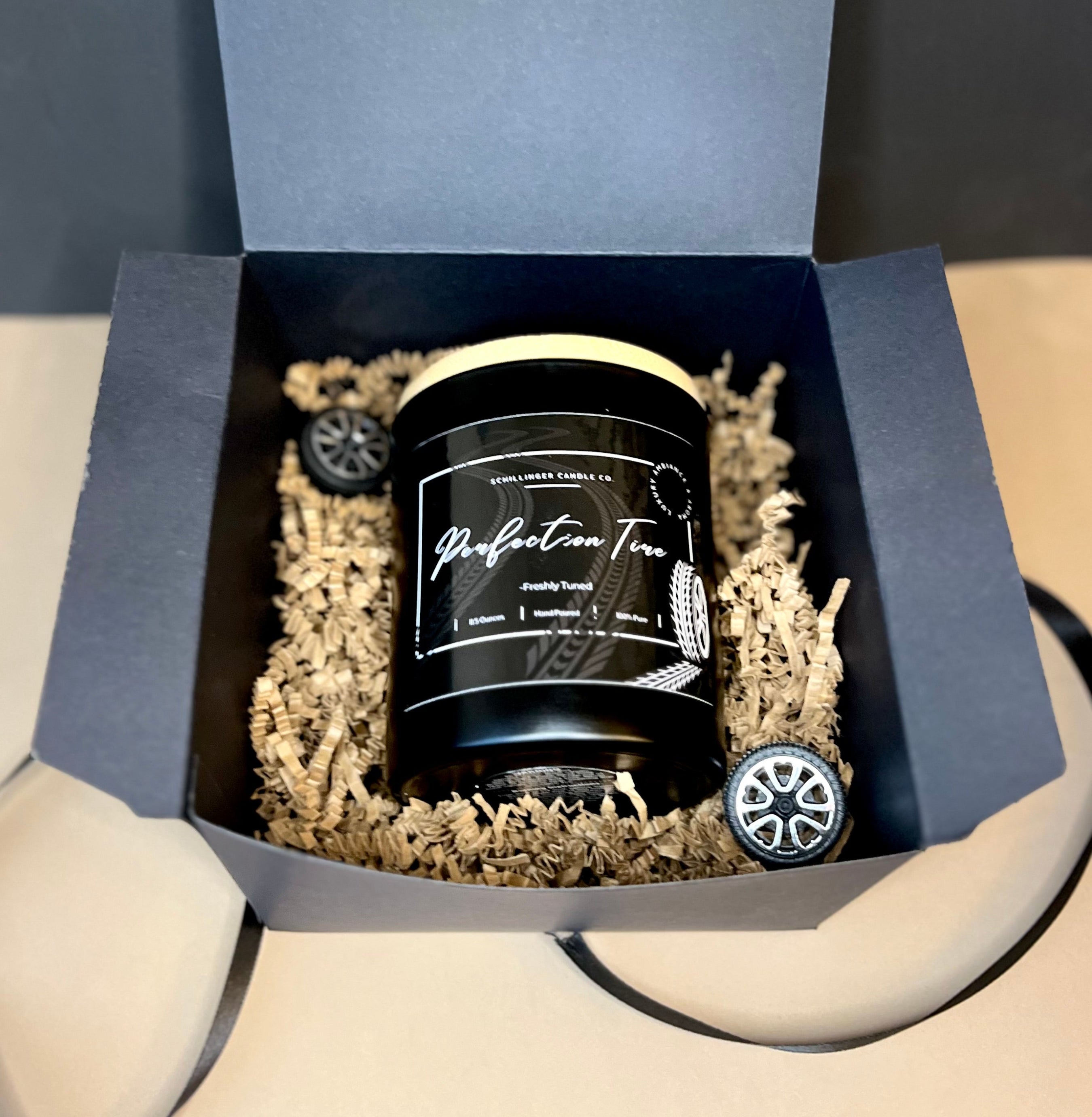 Candle in a decorative box with decorative elements